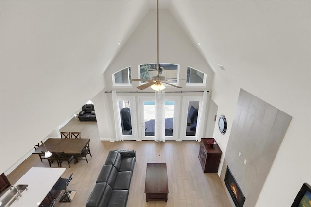 4104 Belisario Ct, Leander, TX 78641 - living room with high vaulted ceiling, light wood-type flooring, and ceiling fan