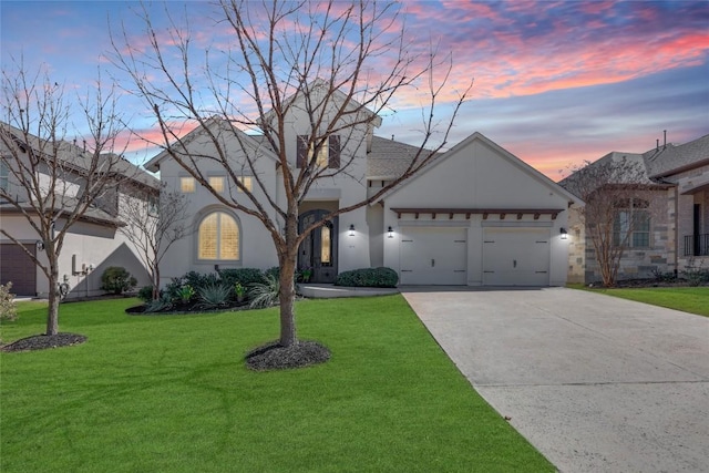 4104 Belisario Ct, Leander, TX 78641 - view of front of home with stucco siding, concrete driveway, a front yard, and an attached garage