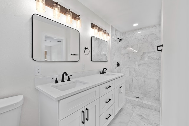 1520 Weyford Dr, Austin, TX 78757 - bathroom with marble look tile flooring, double vanity, and tiled shower