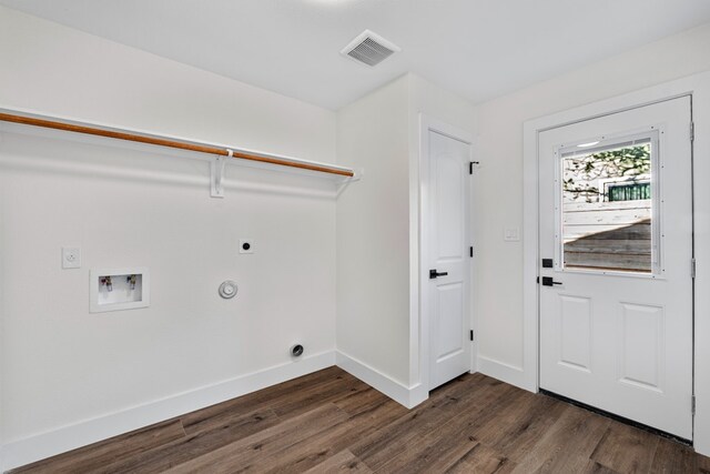 1520 Weyford Dr, Austin, TX 78757 - washroom with hookup for an electric dryer, dark wood-style flooring, hookup for a washing machine, and hookup for a gas dryer