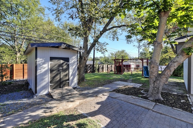 1520 Weyford Dr, Austin, TX 78757 - fenced backyard featuring a playground and a storage shed