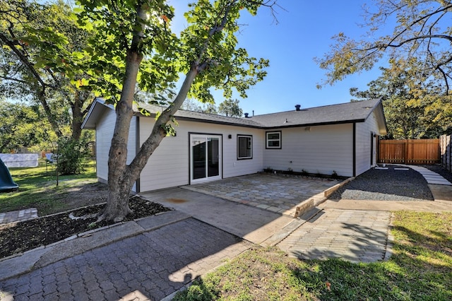 1520 Weyford Dr, Austin, TX 78757 - rear view of property with a patio area