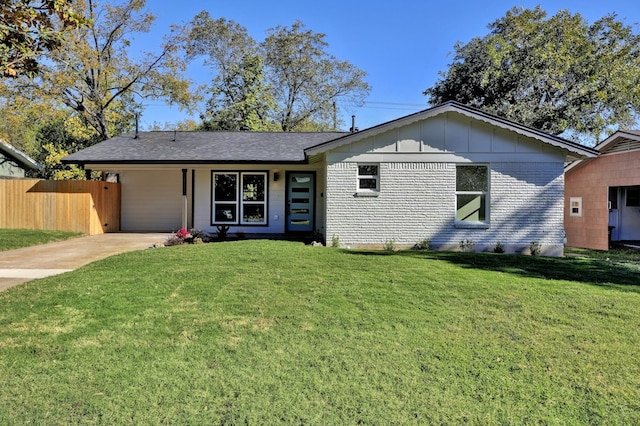 1520 Weyford Dr, Austin, TX 78757 - view of front of house featuring driveway, an attached carport, board and batten siding, and brick siding