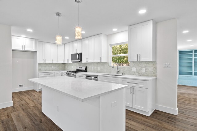 1520 Weyford Dr, Austin, TX 78757 - kitchen featuring appliances with stainless steel finishes, dark wood-style flooring, recessed lighting, light countertops, and white cabinets