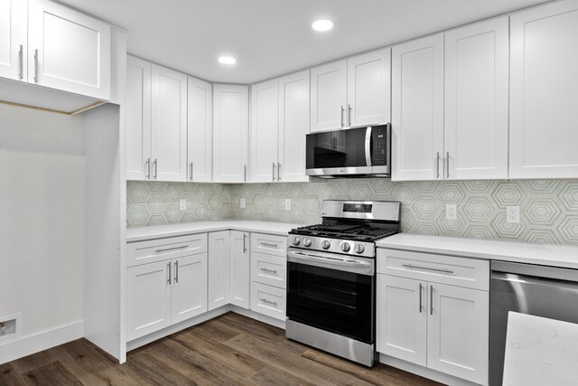 1520 Weyford Dr, Austin, TX 78757 - kitchen with stainless steel appliances, light countertops, white cabinetry, decorative backsplash, and dark wood finished floors