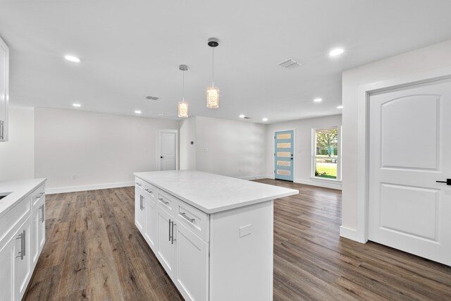 1520 Weyford Dr, Austin, TX 78757 - kitchen featuring open floor plan, white cabinetry, dark wood-type flooring, recessed lighting, and pendant lighting