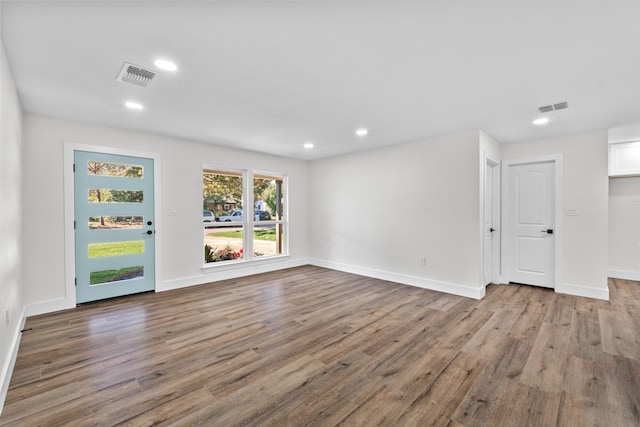 1520 Weyford Dr, Austin, TX 78757 - unfurnished living room with wood finished floors and recessed lighting