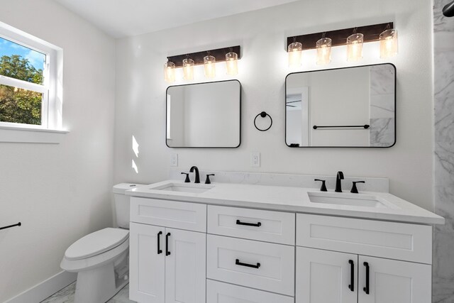 1520 Weyford Dr, Austin, TX 78757 - bathroom featuring marble finish flooring and double vanity