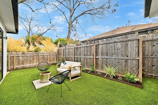 view of yard with a fenced backyard and an outdoor living space