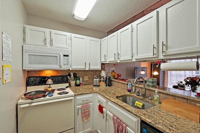 kitchen featuring backsplash, white cabinetry, a sink, a textured ceiling, and white appliances