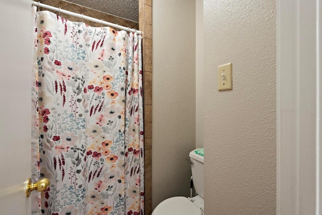 2210 Pearl St Unit 305, Austin, TX 78705 - bathroom featuring a shower with curtain and a textured wall