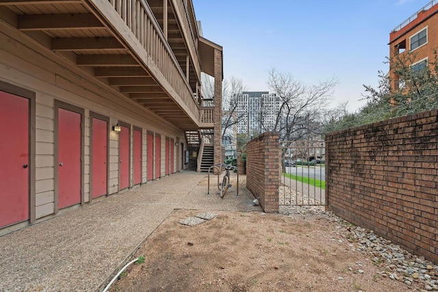 2210 Pearl St Unit 305, Austin, TX 78705 - view of home's exterior featuring stairs and a gate
