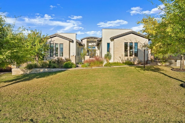 view of front of property with a front lawn