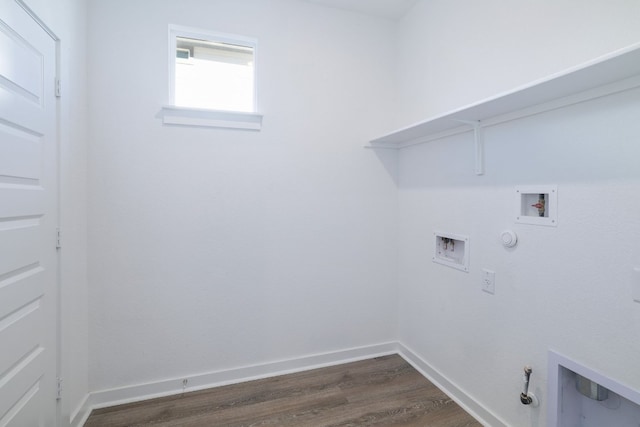 laundry area with washer hookup, dark wood-style flooring, gas dryer hookup, laundry area, and baseboards