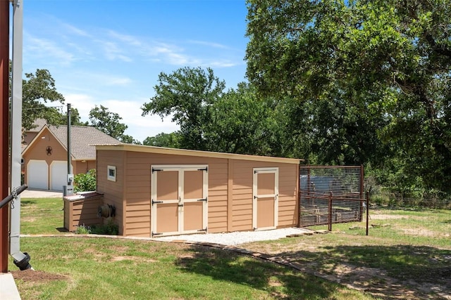 view of shed with fence