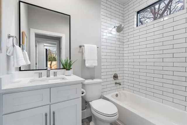 full bathroom featuring bathing tub / shower combination, vanity, and toilet