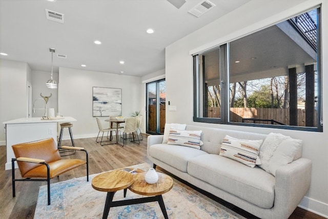 5403 Duval St Unit 2, Austin, TX 78751 - living room featuring wood finished floors and recessed lighting
