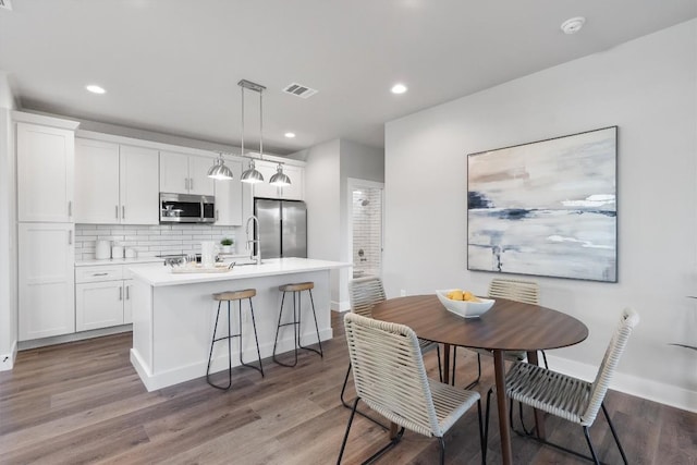 5403 Duval St Unit 2, Austin, TX 78751 - dining area with light wood-type flooring and recessed lighting
