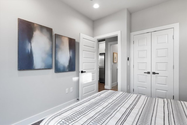 5403 Duval St Unit 2, Austin, TX 78751 - unfurnished bedroom featuring a closet, freestanding refrigerator, and recessed lighting