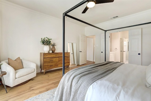 bedroom with light wood-type flooring, a ceiling fan, visible vents, and crown molding