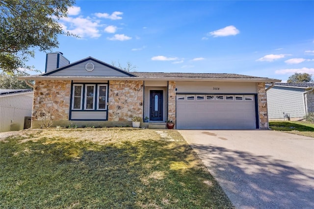 single story home featuring concrete driveway, stone siding, a chimney, an attached garage, and a front yard