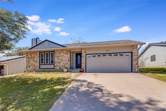 ranch-style house with driveway, stone siding, a chimney, an attached garage, and a front lawn