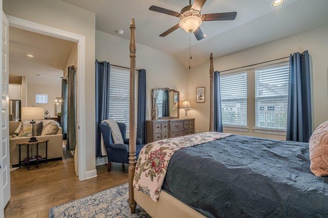 409 Flying Orchid Dr, San Marcos, TX 78666 - bedroom with wood finished floors, a ceiling fan, vaulted ceiling, and recessed lighting