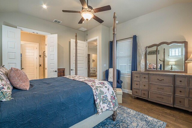 409 Flying Orchid Dr, San Marcos, TX 78666 - bedroom with dark wood-style floors, vaulted ceiling, and ceiling fan