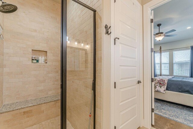 409 Flying Orchid Dr, San Marcos, TX 78666 - bathroom with connected bathroom, a shower stall, ceiling fan, wood finished floors, and recessed lighting