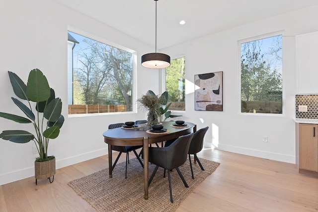 4402 Garnett St Unit 1, Austin, TX 78745 - dining space featuring light wood finished floors, baseboards, and recessed lighting