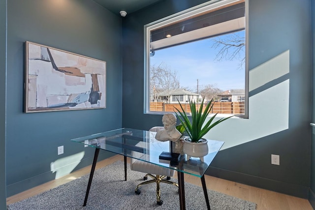 4402 Garnett St Unit 1, Austin, TX 78745 - office area featuring wood finished floors, healthy amount of natural light, and baseboards
