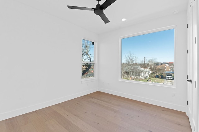 4402 Garnett St Unit 1, Austin, TX 78745 - spare room with baseboards, wood finished floors, a ceiling fan, and recessed lighting