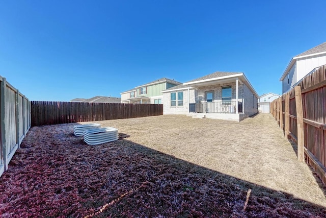 view of yard with a fenced backyard