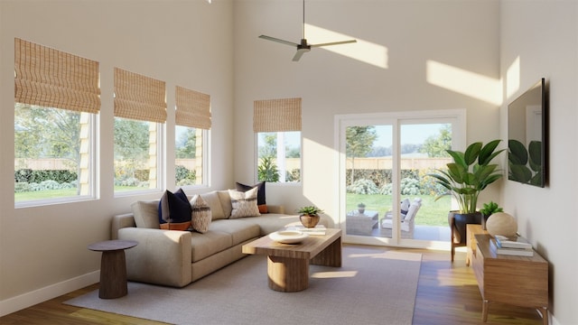 sunroom / solarium featuring a ceiling fan