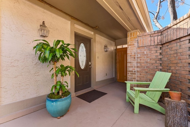 property entrance with stucco siding