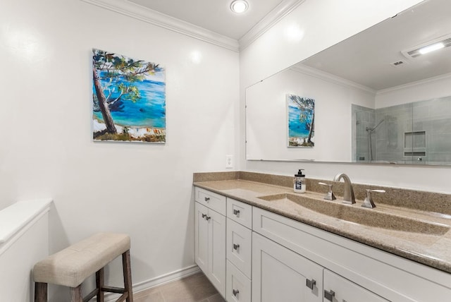 full bath featuring visible vents, vanity, baseboards, ornamental molding, and a tile shower