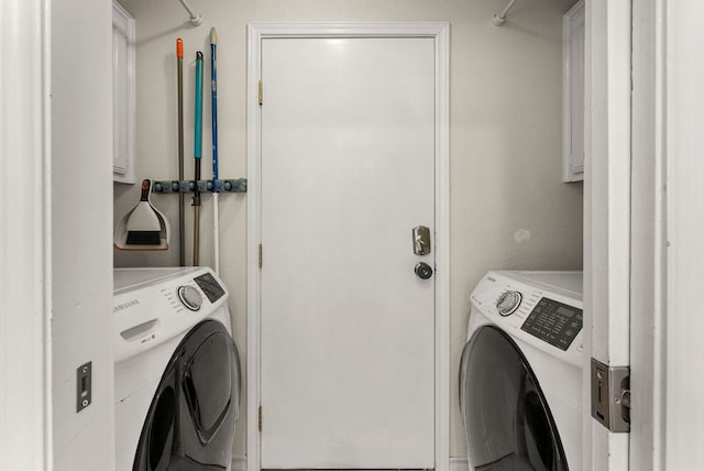 laundry area with cabinet space and washing machine and dryer