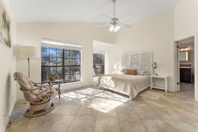 bedroom featuring baseboards, high vaulted ceiling, ceiling fan, and tile patterned floors