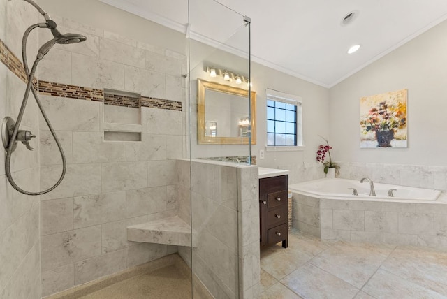 bathroom with tile patterned flooring, a garden tub, vanity, ornamental molding, and a tile shower