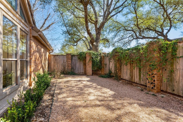 view of yard with a fenced backyard