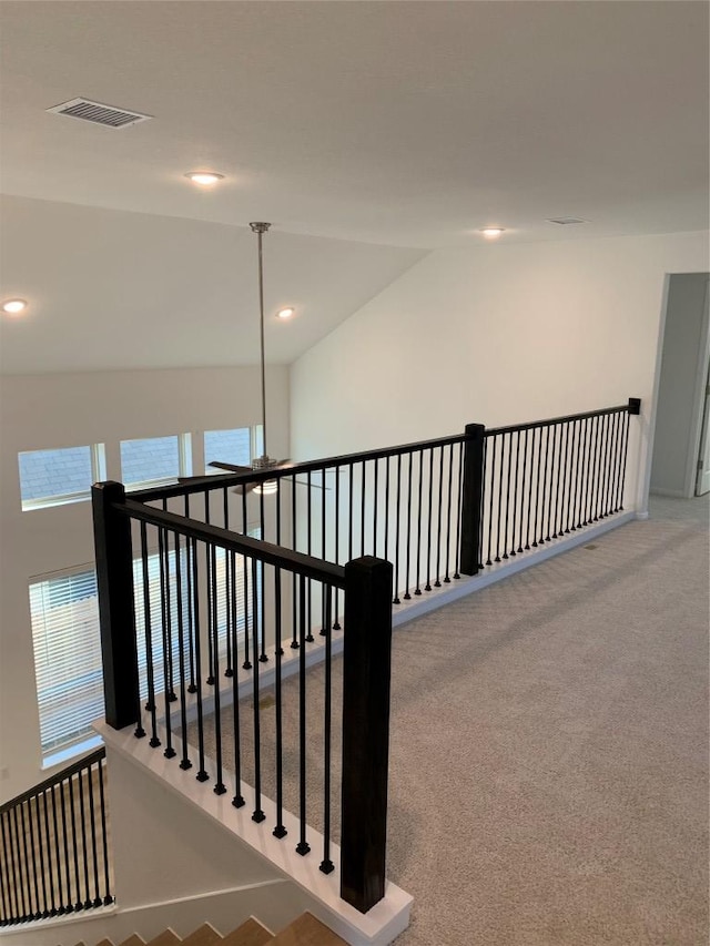 hall with recessed lighting, a healthy amount of sunlight, and visible vents