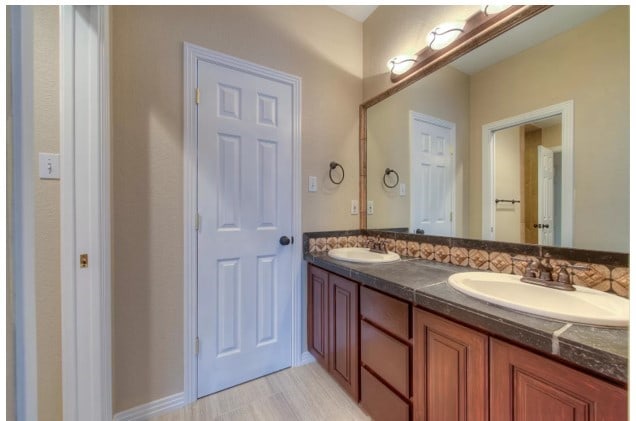 bathroom with double vanity and a sink