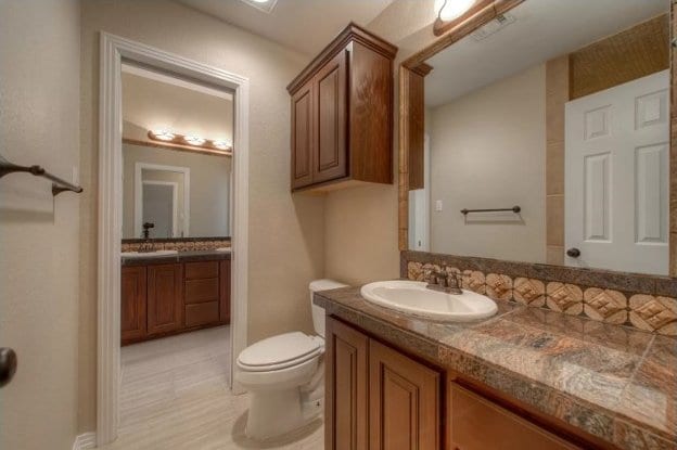 bathroom with toilet and vanity