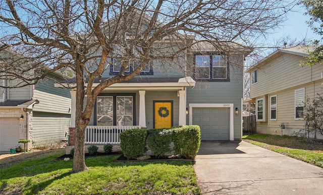 view of front of property featuring covered porch, concrete driveway, and a garage