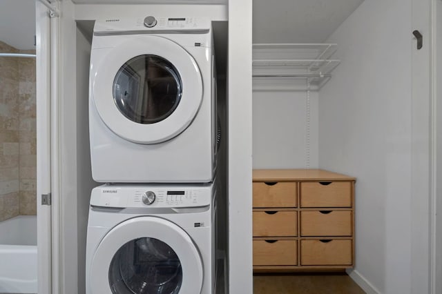 2235 E 6th St Unit 210, Austin, TX 78702 - laundry room featuring stacked washer / dryer