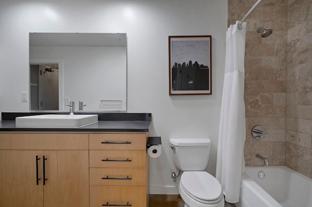 2235 E 6th St Unit 210, Austin, TX 78702 - full bath with vanity, toilet, shower / tub combo with curtain, and baseboards