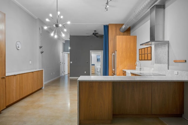 2235 E 6th St Unit 210, Austin, TX 78702 - kitchen featuring ceiling fan, wall chimney exhaust hood, black electric stovetop, finished concrete flooring, and a peninsula