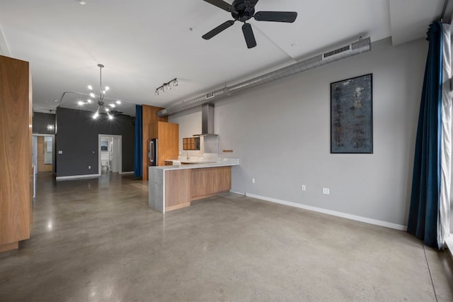 2235 E 6th St Unit 210, Austin, TX 78702 - kitchen with concrete flooring, open floor plan, modern cabinets, a peninsula, and a ceiling fan