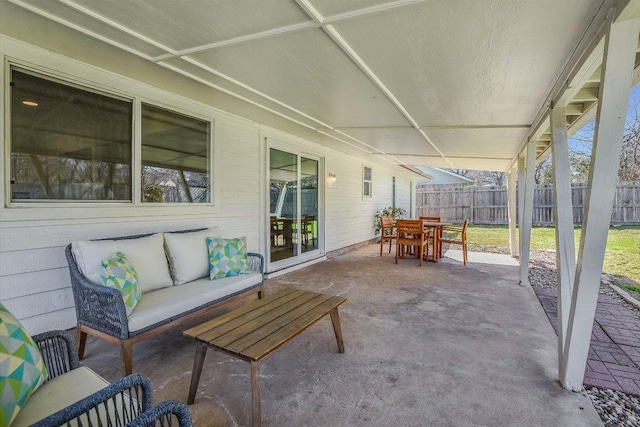 view of patio / terrace featuring outdoor dining space, outdoor lounge area, and fence