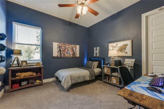 bedroom with carpet flooring, ceiling fan, baseboards, and lofted ceiling